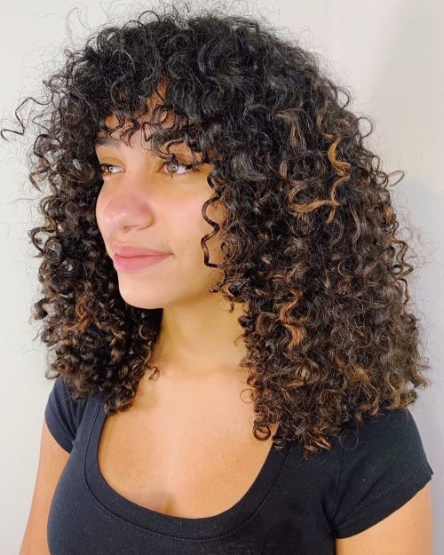 Curly bangs is a hairstyle where the bangs are curled from the pilus These are The fifteen Cutest Curly Bangs You Should Consider Trying