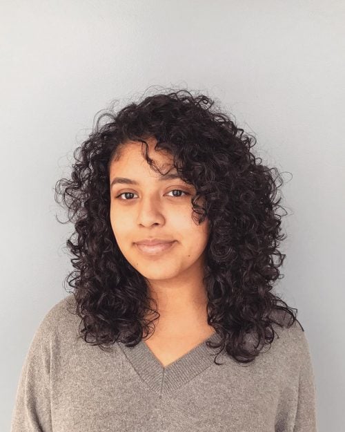 Naturally curly pilus amongst bangs results inwards a seriously fashionable explosion of book too tex The xvi Cutest Examples of Naturally Curly Hair amongst Bangs