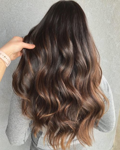 A nighttime brownish balayage is a pilus color characterized past times softer xiii Gorgeous Examples of Dark Brown Balayage Hair Colors