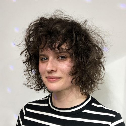 Curly bangs is a hairstyle where the bangs are curled from the pilus These are The fifteen Cutest Curly Bangs You Should Consider Trying