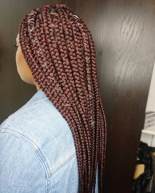 Burgundy box braids are a protective hairstyle dyed inwards a darker shade of ruddy in addition to divided i The xiii Hottest Burgundy Box Braids