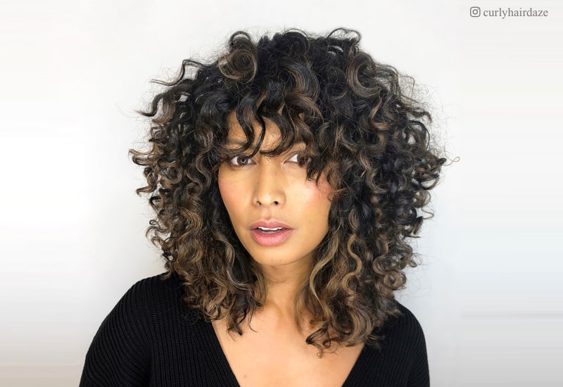 Image of Shoulder length layered curly hair