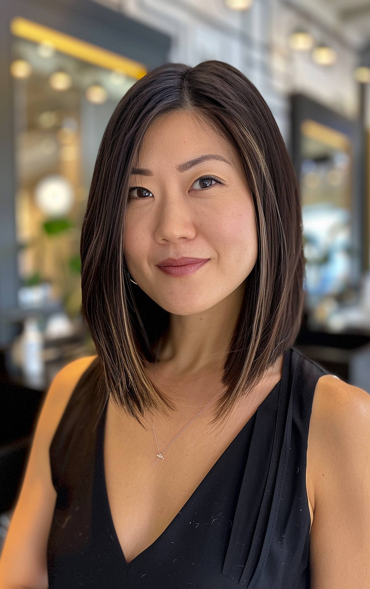 Long bob haircut with angled ends and balayage for Asian women