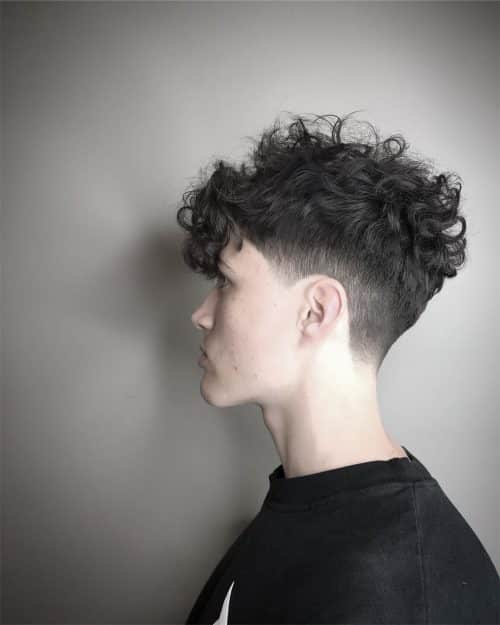 A curly pilus fade is a type of fade that xvi Awesome Examples of Curly Hair Fade Haircuts