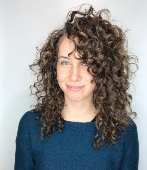 Naturally curly pilus amongst bangs results inwards a seriously fashionable explosion of book too tex The xvi Cutest Examples of Naturally Curly Hair amongst Bangs