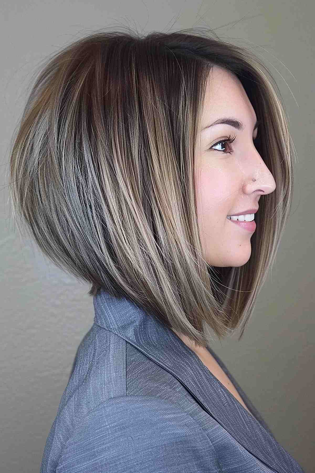 Sleek inverted bob with longer front layers and subtle highlights, ideal for fine to medium hair.